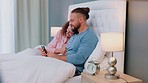 Love, phone and couple in bed talking, bonding and in conversation together in evening. Relax, joy and man and woman laying in bedroom using smartphone for social media, internet and laughing at meme