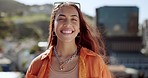 Woman smile and city of a person on a roof feeling happy outdoor with wind and sun. Portrait of a young and gen z person from Spain with happiness and relax feeling in the sunshine with freedom