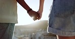Summer, love and couple holding hands in the city of Portugal for a holiday together. Support, trust and man and woman with affection, sunshine view and travel on a vacation for adventure with flare