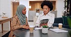 Digital tablet, office and business women in collaboration talking in a corporate modern office. Teamwork, African and muslim employees working on a project with a mobile device  in a workplace.