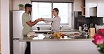 Couple, dance and cooking healthy food in kitchen together for energy, nutrition and wellness while dancing for fun, happiness and love. Man and woman relax and happy in marriage and home apartment
