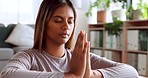 Woman, yoga and meditation for spiritual health, wellness and relaxing or calm zen exercise at home. Female in fitness, breathing and meditating for healthy mind, awareness or mental wellbeing inside