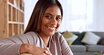 Relax, youth and a portrait of woman on sofa with smile and happiness at home in city apartment in India. Happy, healthy and stress free, young Indian girl smiling and relaxing sitting alone on couch