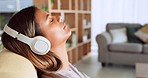 Meditation, music and relax with mexican woman headphones for music, podcast or wellness. Audio technology, streaming and service with girl in living room listening for calm, spiritual and lifestyle
