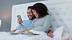 Smartphone, laugh and couple in bed to relax and watch a video on social media or the internet. Happy, technology and young man and woman looking at funny picture or meme on cellphone in the bedroom.