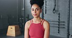 Fitness, gym and woman wth focus for exercise, health and workout at a club. Portrait of a young, sports and healthy girl training for wellness, goal for body and cardio with motivation to be strong