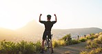 Bike, freedom and motivation with a man cyclist celebration while in nature for fitness or exercise. Mountian, sky and success with a male bicycle rider cheering as a winner on a summit at sunset