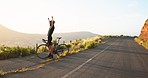 Man, bicycle and fitness, celebrate on the road, cyclist excited and winner with arms raised, success while training outdoor. Bike, cycling and exercise, athlete at sunrise, healthy and active life.