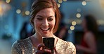 Young caucasian woman laughing using phone at party