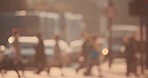 Blurred busy background of a person riding a motorbike through a crowd of people in the city