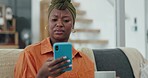 Black woman, smartphone or confused on living room sofa with phishing email, hacker news or social media security glitch. Warning, worry or thinking person with technology 404 scam or internet fraud