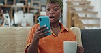 Phone, coffee and shocked black woman in home reading fake news, internet gossip or message. Tea, omg and female from Nigeria on 5g mobile surprised by trending online story or social media content.