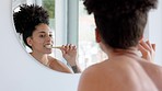Mirror, black woman and brushing teeth in bathroom, wellness and hygiene to clean, bare and towel. Oral health, African American female and tooth brush with toothpaste for fresh breath and smile.