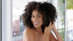 Black woman, natural hair and beauty while getting ready and feeling happy about hair care, growth and afro curl in home bathroom. Face portrait of a african model during morning self care routine