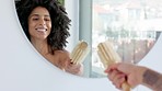 Bathroom, sign and dance with a black woman brushing hair in the mirror while getting ready in her home. Fun, happy and playful with an attractive young female joking while reflecting on haircare