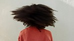 Afro woman shaking natural hair curls with white wall background and mockup or copy space. Funky, carefree and empowerment girl with retro hairstyle for hair care, style or fashion stylist mock up
