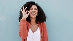 Black woman, perfect hand and sign for success with studio mockup wall for influencer campaign. Happy girl showing yes, cool and ok gesture for approval of idea expression with copy space.