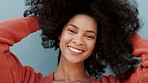 Happy hair care, freedom and smile of a woman with an afro feeling textures. Female from Guatemala with happiness enjoying healthy, natural and real hairstyle texture with a fun and free mindset