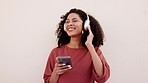 Woman, dance and listening to music, podcast and radio on bluetooth headset, phone and technology. Happy, smile and black woman with 5g network, freedom and free girl dancing with headphones outdoor.