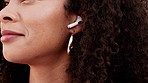 Wireless earphones, music and girl listening to radio song, happy or streaming audio podcast. Peace, wellness and relax mind for black woman with bluetooth tech to listen to sound for stress relief