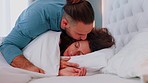 Morning kiss, couple and sleeping woman with a man showing care, love and resting. Girlfriend in a home bedroom bed busy with sleep or afternoon nap rest with a boyfriend leaving the house 