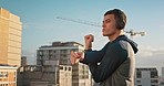 Man, music headphones or fitness stretching on Portugal city rooftop for exercise, training or workout. Sports, personal trainer or coach in warmup and listening to health radio or motivation podcast