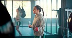 Fitness, woman and skipping with rope at the gym for health cardio exercise, training or workout indoors. Active female exercising with jumping ropes for healthy lifestyle, endurance or sports inside