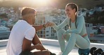 Fitness, couple and fist bump for sports exercise, workout or training together in the city outdoors. Happy woman and man in social conversation, communication or talking after cardio exercising