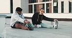 Fitness, couple and stretching in the city for exercise, training or workout together on a roof top in the outdoors. Active man and woman in morning sports leg stretch for warm up, cardio or wellness