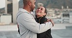 Happy, black couple and rooftop for hug, love or romance in city, metro or town together outdoor. Happiness, young couple and embrace with smile, bonding or care on roof, skyscraper or building