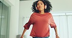 Black woman, dance on sofa and relax with freedom, headphone and have fun in living room. African American girl, digital device and move being free, dancing or music with rhythm, content and on sofa