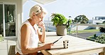 Mature woman, coffee and remote working tablet on house, home or hotel balcony in startup or small business strategy planning. Thinking entrepreneur, worker and employee on technology in vision ideas