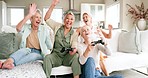 Senior women, video game and friends playing together while relaxing on sofa in the living room. Happy, celebration and elderly gamers in retirement with tv entertainment in the lounge at modern home