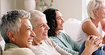 Diversity, elderly women and happy laughing on sofa at nursing home. Friends, senior people talking together and communication smile or watching comic movie on television sitting on couch in lounge