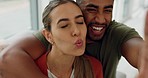 Couple take selfie, happy and kiss with hug, love and playful with fun bonding together and spending quality time at home. Portrait of man and woman, romantic and funny, laughing and comic.