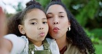 Selfie, happy and mother and girl in park with silly kiss face for summer, bonding and social media. Family, funny and garden with mom and child in countryside for relax, weekend and spring lifestyle