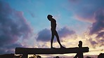 Silhouette, fitness and woman on balance beam against night sky background for gymnastics, acrobat and training. Yoga, shadow and girl meditation in nature for wellness, zen and mind, peace and chakra