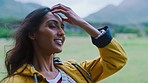 Freedom, calm and outdoor woman with natural hair in nature walking or on a hike with happiness. Female from India in a park touching healthy haircut feeling free on a walk with peace and zen