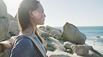 Ocean view, woman and travel of a walking or hiking person doing fitness and workout with bokeh. Exercise, training and sea walk of an outdoor traveler on a cliff feeling freedom and calm in the sun 