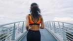 Running on bridge, black woman and fitness with runner in urban city, exercise and healthy active lifestyle. Athlete back view, run outdoor for cardio and training for marathon or race with workout.