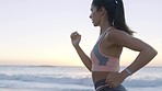 Beach, sky sunset and woman running for outdoor cardio health, peace and fresh air while training for marathon race. Sea water, nature freedom and runner workout for exercise, fitness and wellness