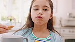 Cookie, snack and face of a child with milk for breakfast, lunch or comfort food. Health, nutrition and portrait of a girl kid eating a biscuit with a healthy drink in the morning for enjoyment