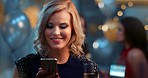 Young caucasian woman using a phone smiling at party