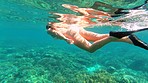 Woman swimming in the ocean