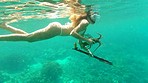 Woman swimming in the ocean