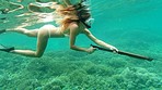 Woman swimming in the ocean