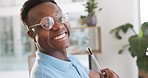 IT technician, portrait and black man relax at work while holding a pen during development break. Ux, ui and face of geek african american male resting at information technology workplace 
