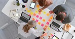 Top view, sticky notes and team planning, brainstorming for marketing strategy or discussion for business sales growth. Post it, teamwork and research for group project, conversation or collaboration