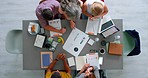 Top view of business people, marketing team and branding management planning logo, creative strategy and ideas in startup company. Designers, advertising meeting and teamwork collaboration at table 