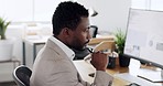 Black man, business and thinking at computer with data analysis and corporate professional, working with technology and analysis of graphs. Businessman at desk, reading report and research statistics
